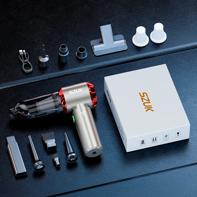 Veylans Standard in red: the handheld unit with six attachments, two HEPA filters, USB-C cable and retail box laid out on dark leather