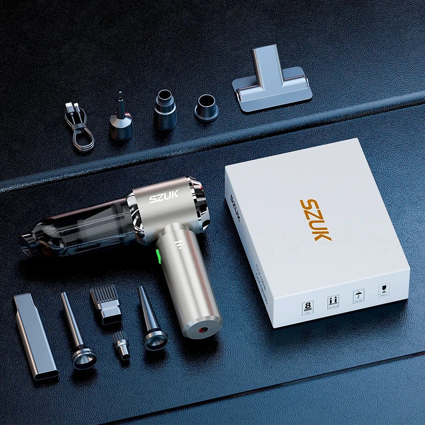 The complete Veylans V1 kit laid out on dark leather: handheld unit, nozzles, brush, T-head, USB-C cable and retail box